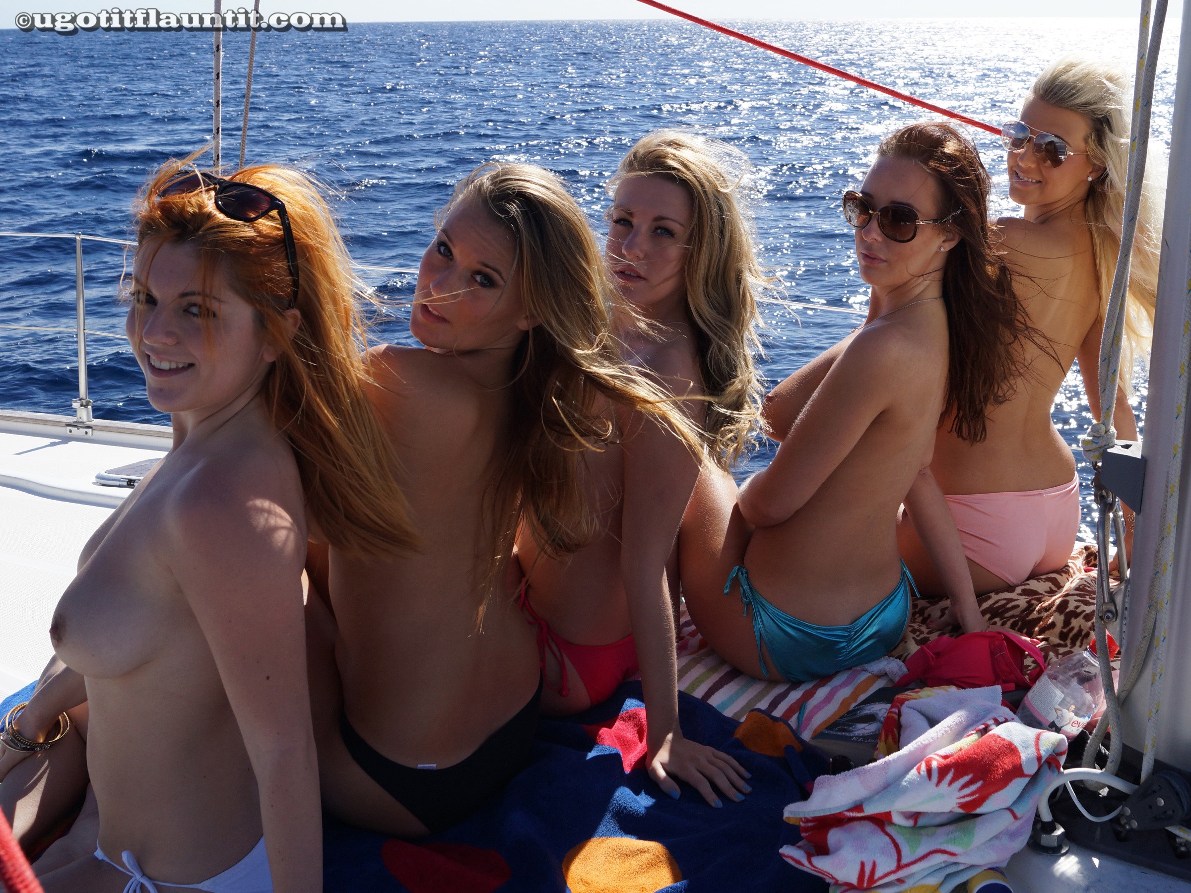 Five Topless Girls on a Boat
