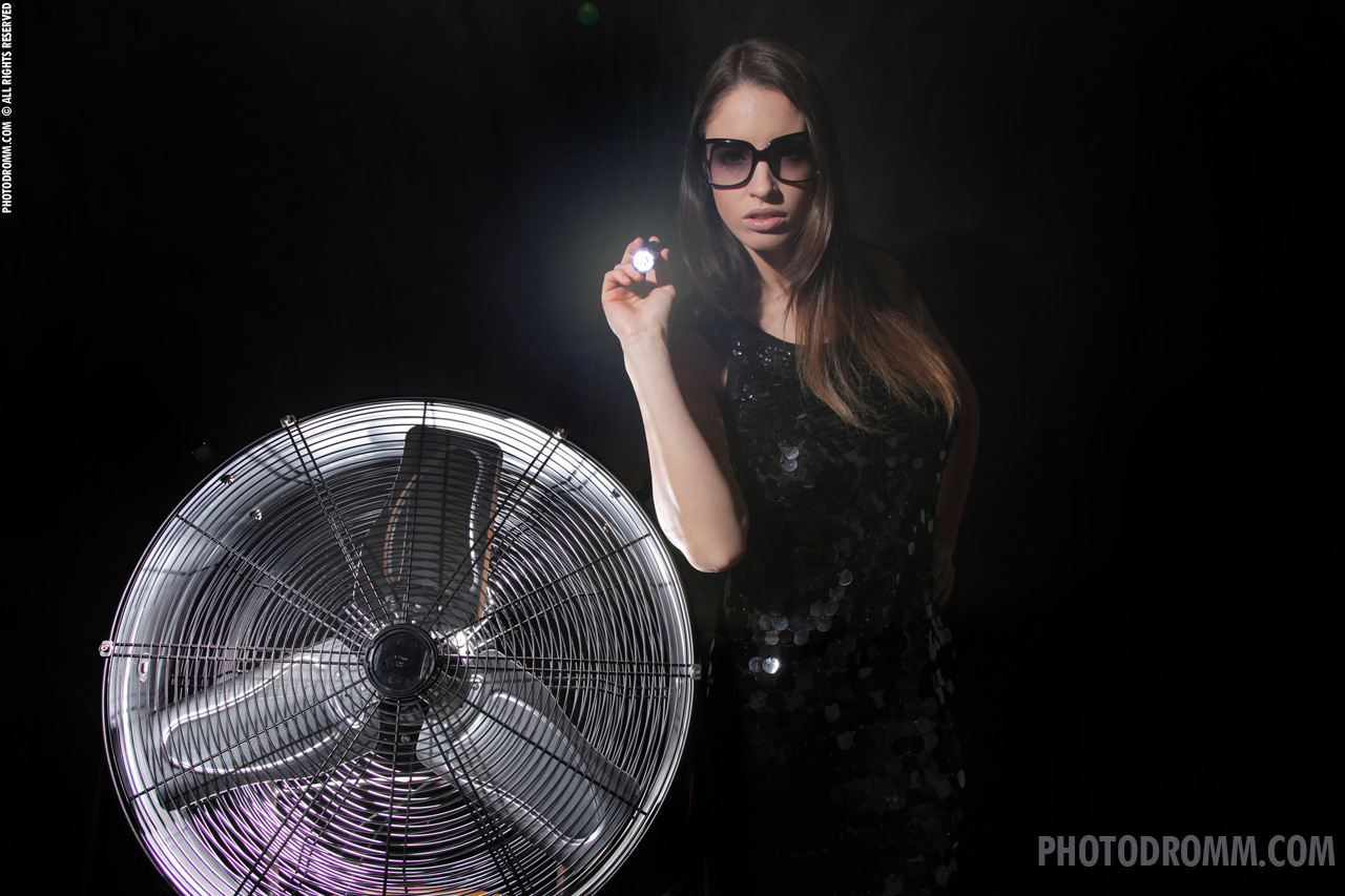 Luciana Strips with a Fan and Flashlight