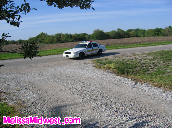 Melissa Midwest Steals a Cop Car